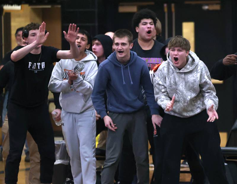 DeKalb wrestlers celebrate as DeKalb’s Hayes Halstead wins over Sycamore’s Sawyer Davis at 138 pounds Friday, Jan. 16, 2026, at Sycamore High School.