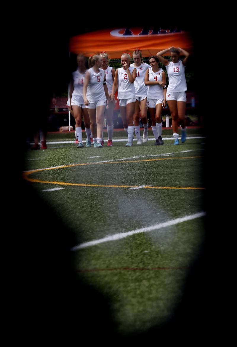 Timothy Christian players walk to get the fourth place trophy after the IHSA Class 1A State Girls Soccer third-place match on against Williamsville Friday, June 6, 2025, at North Central College in Naperville.