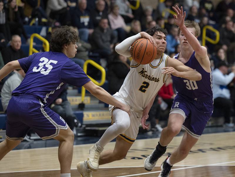 Sterling’s JP Schilling drives to the hoop against Rochelle Tuesday, Jan. 31, 2023.