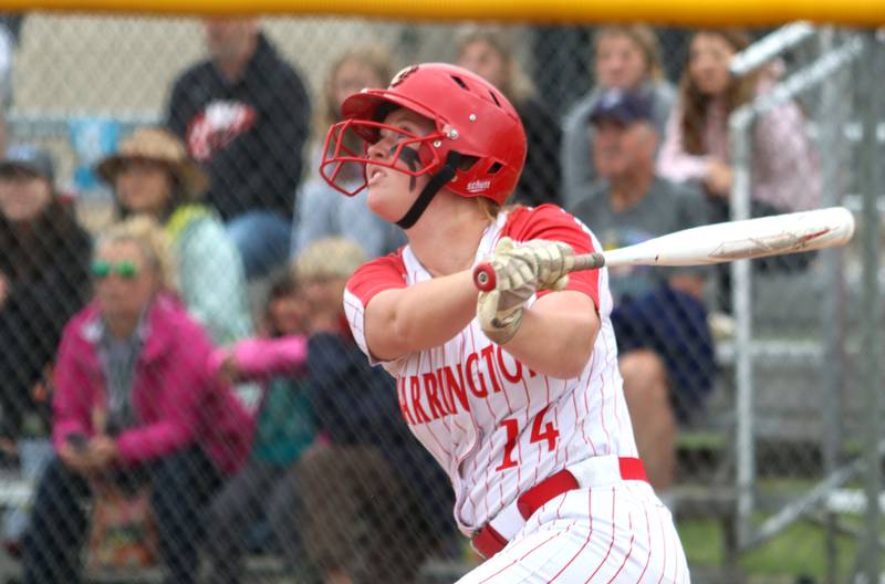 Barrington’s Ellie Wintringer watches the flight of her sacrifice fly, which gave the Fillies a seventh-inning lead during the Class 4A Huntley Sectional championship, Saturday, June 4, 2022.