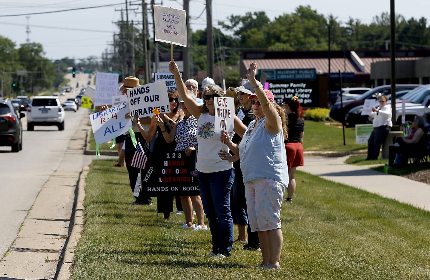 Protesters line Route 31 in front of the McHenry Public Library on Friday, June 20, 2025, during a Save Our Libraries Protest hosted by Indivisible McHenry County to draw attention to cuts to the nation’s libraries by the Trump administration.