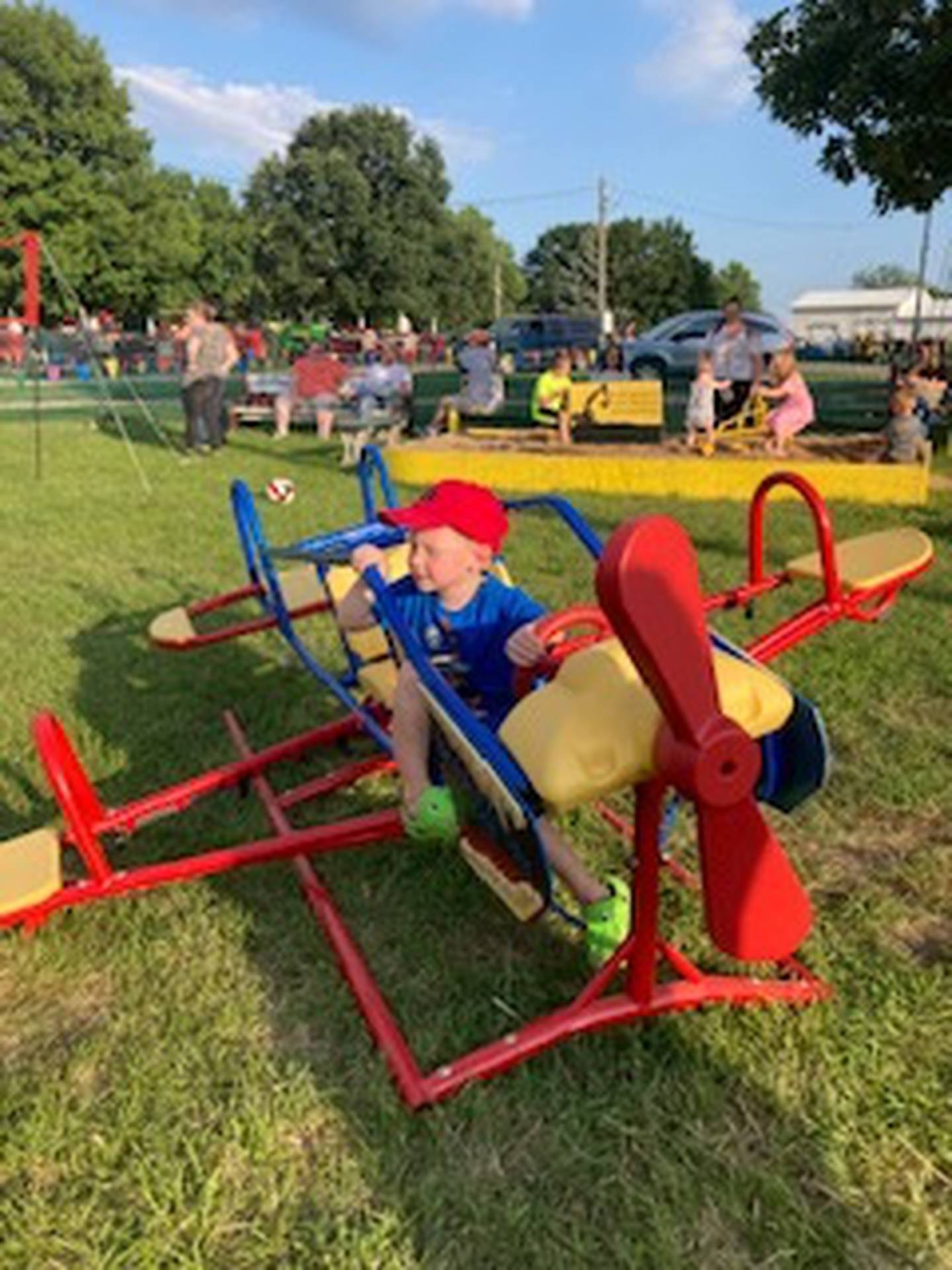Levi Stutzman, son of Barry and Barby Stutzman, of Minonk, enjoys the crop duster airplane.