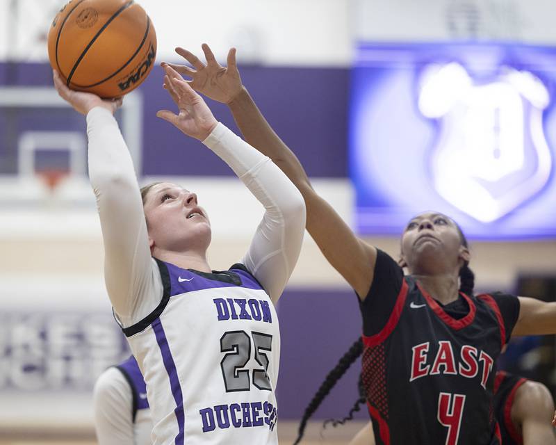 Dixon’s Presley Lappin puts up a shot against Rockford East’s J’Lynn Sims Monday, Feb. 16, 2026.