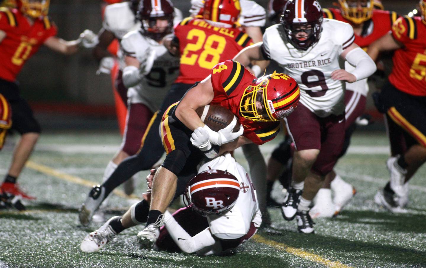 Batavia’s Charlie Whelpley is taken down with the ball during a Class 7A round 1 playoff game against Brother Rice in Batavia on Friday, Oct. 27, 2023.