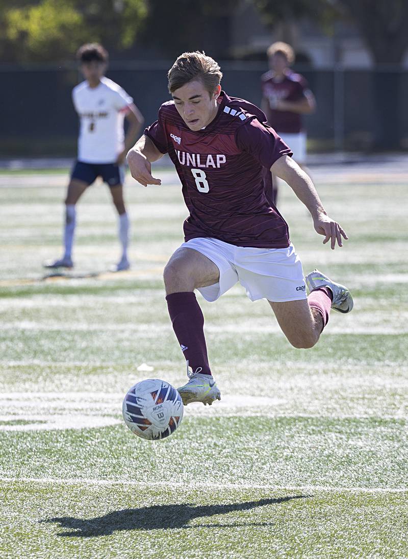 Dunlap’s Tyler Shane brings the ball upfield against Sterling Saturday, Oct. 21, 2023 in the regional finals game in Sterling.