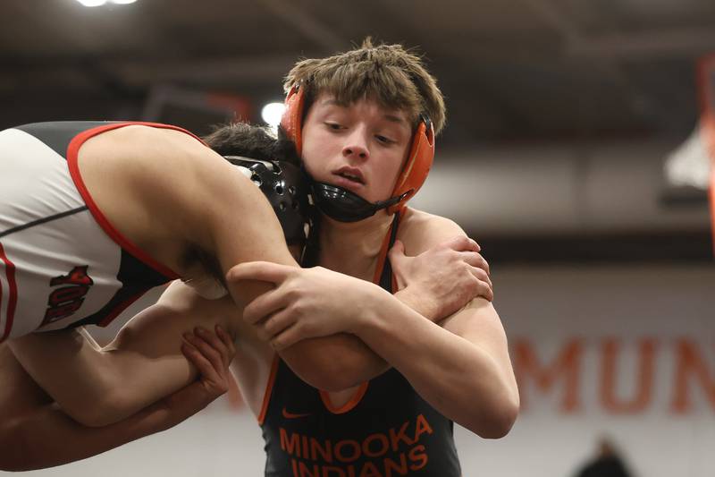 Minooka’s Mason Vogt works against Yorkville’s Donncha Souza in the SouthWest Prairie Conference 157 pound championship on Saturday, Jan. 24, 2026 in Minooka.