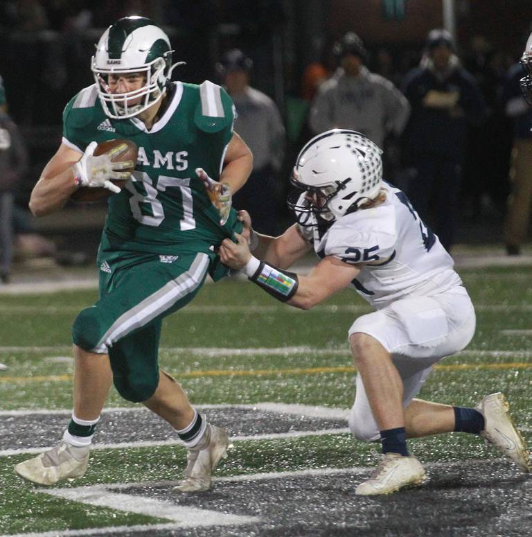 Grayslake Central's Kurt Heerdegen is tackled by Cary-Grove's Colin Desmet in the third quarter during the Class 6A second-round football game at Grayslake Central.