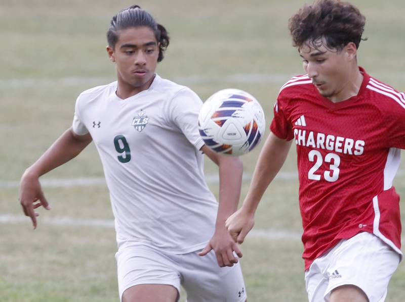 Dundee-Crown's Diego Flores tries to beat Crystal Lake South's Ali Ahmed to the ball during a Fox Valley Conference soccer match Tuesday, Sept. 5, 2023, at Dundee-Crown High School in Carpentersville.