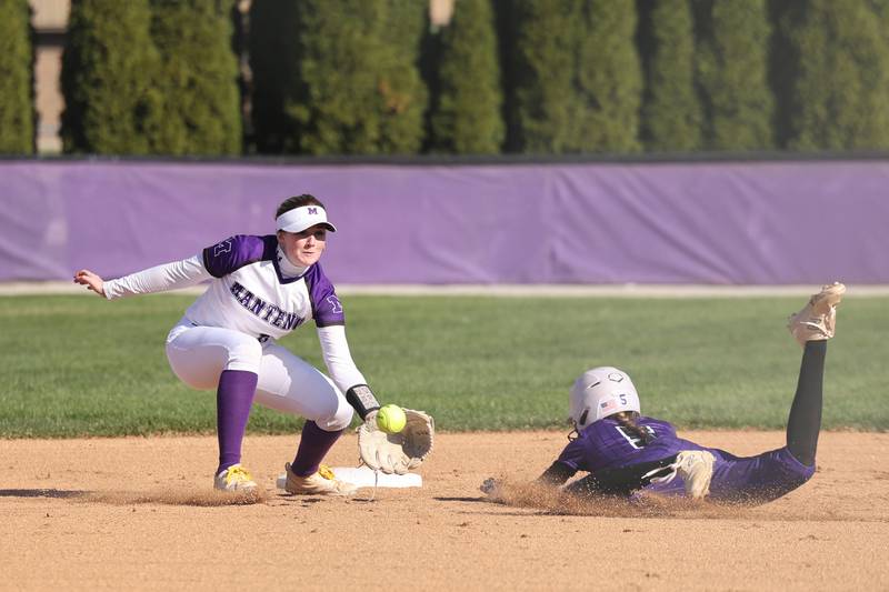 Manteno's Aubrie Goudreau catches a throw to second base as Wilmington's Keeley Walsh narrowly steals the base during the Panthers' 9-7 victory over the Wildcats on Tuesday, April 8, 2025.
