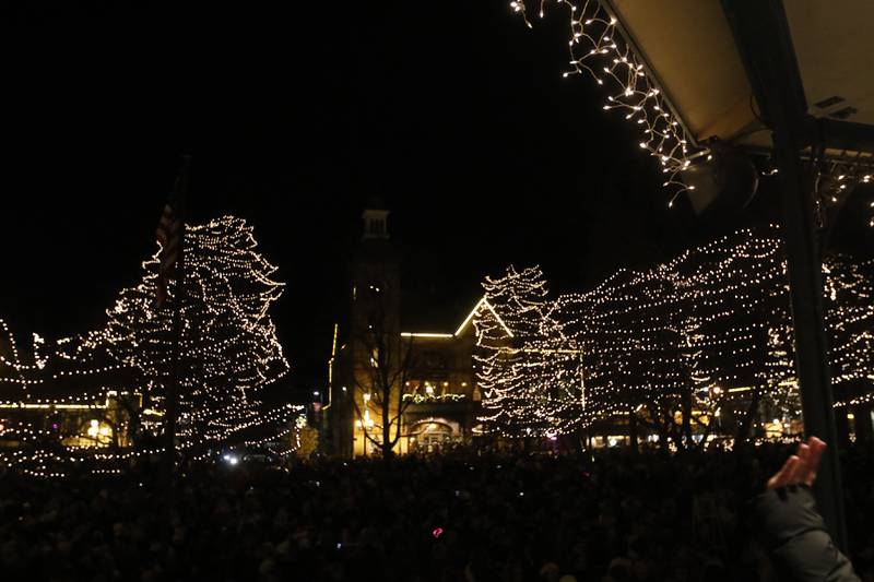 Some of the ten thousand lights shine during the Lighting of the Square Friday, Nov. 25, 2022, in Woodstock. The annual event featured brass music, caroling, free doughnuts and cider, food trucks, festive selfie stations and shopping.