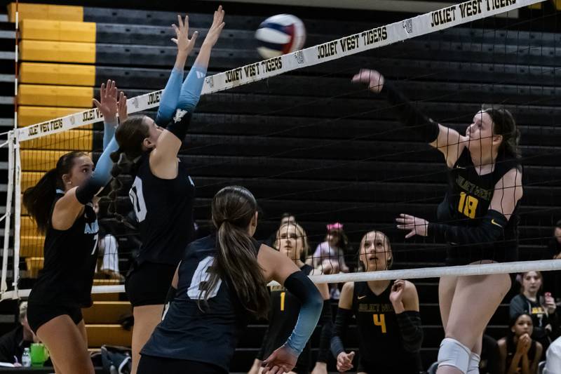 Joliet West's Penny Wagner spikes during a varsity volleyball home game against Joliet Catholic on Sept. 4, 2025.