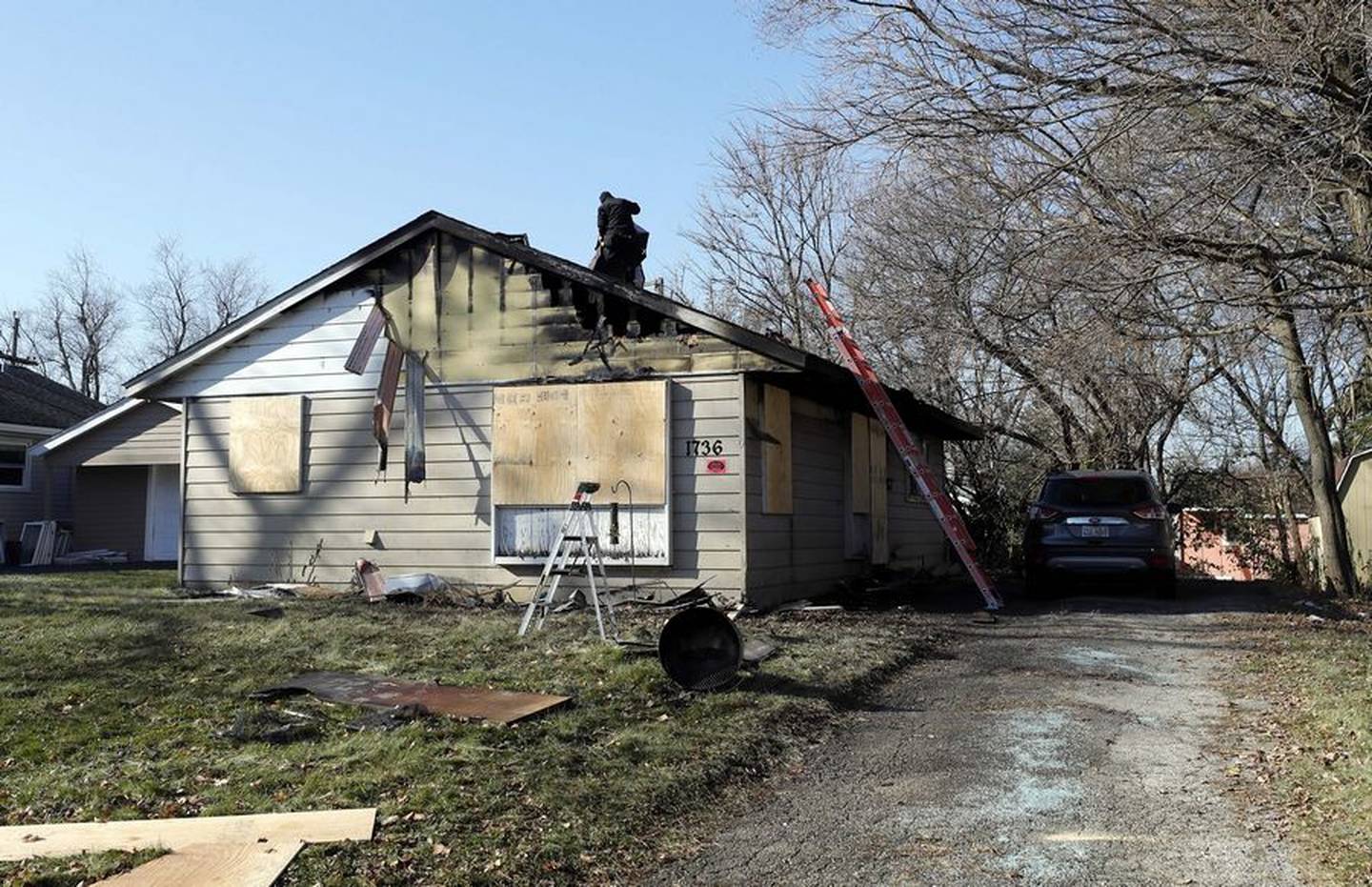 Workers secure the scene of a fatal fire that took place early the morning of Wednesday, Nov. 23, 2022, in the 700 block of Papoose Road in Carpentersville.