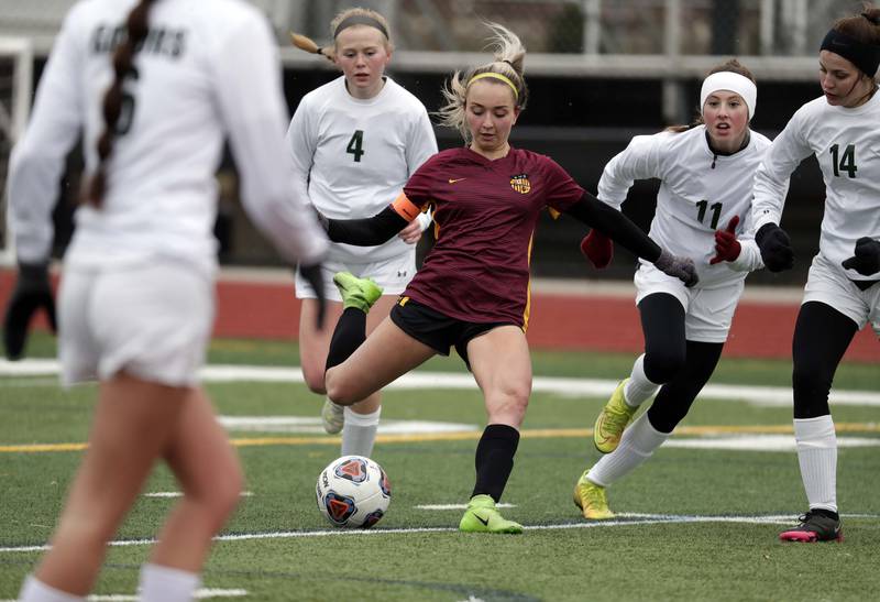 Schaumburg's Emma Salatino shoots past Crystal Lake South's Addie Alexander, left, Lindsay Osterberg, right, and Mackenzie Resch during girls soccer action Saturday, March 26, 2022 in Schaumburg.