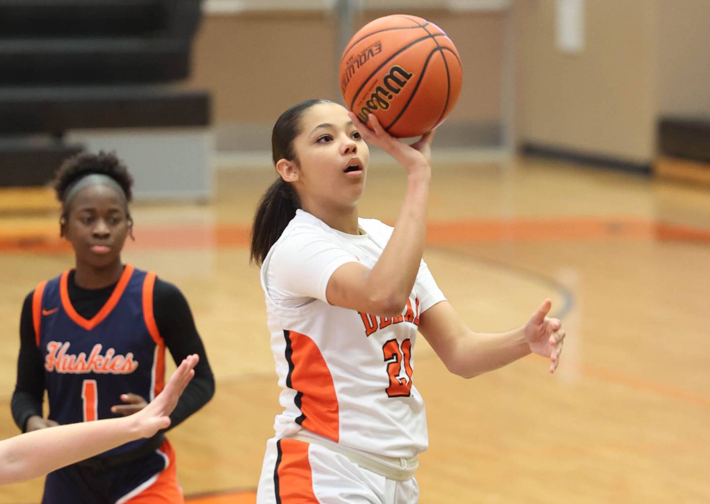 DeKalb’s Alicia Johnson gets off a shot in front of Naperville North's Natalie Frempong Monday, Jan. 22, 2024, during their game at DeKalb High School.
