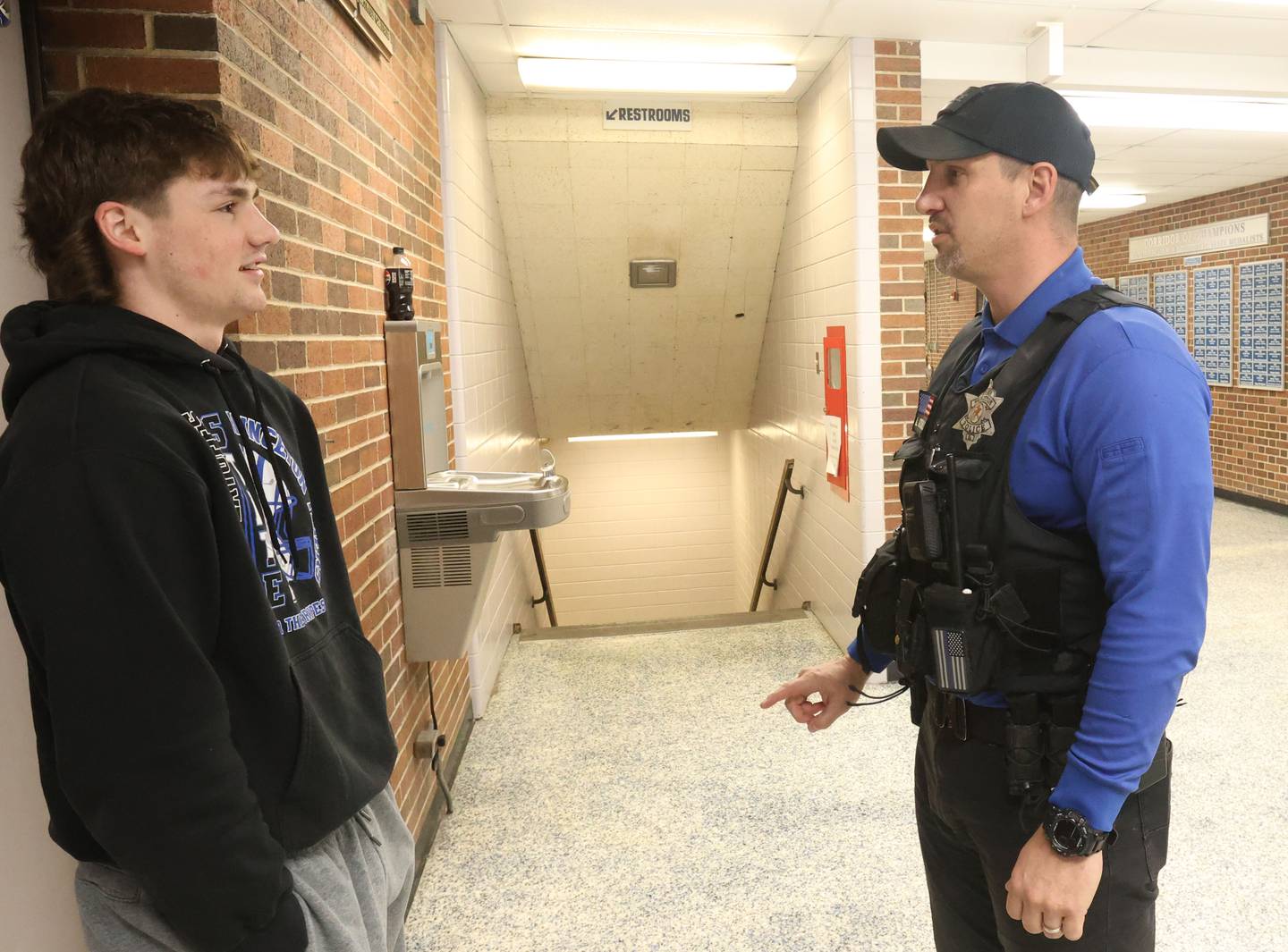 Adam Gutshall ,Police Deptartment School Resource Officer, talks with his nephew Deacon on Wednesday, April 1, 2026 inside Princeton High School.