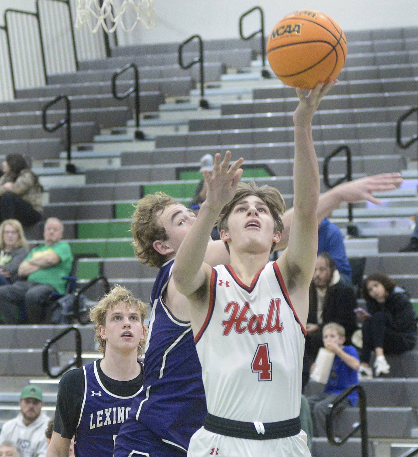 Hall’s Luke Bryant gets past the Lexington defense for a layup in the fourth quarter Friday during the semifinals of the Shipyard Showdown hosted by Seneca High School.