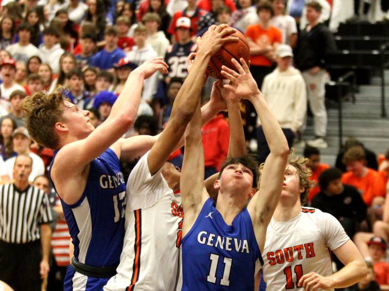 Geneva’s Kalen McNeive (right) goes for the rebound during a game at Wheaton Warrenville South on Friday, Jan. 27, 2023.