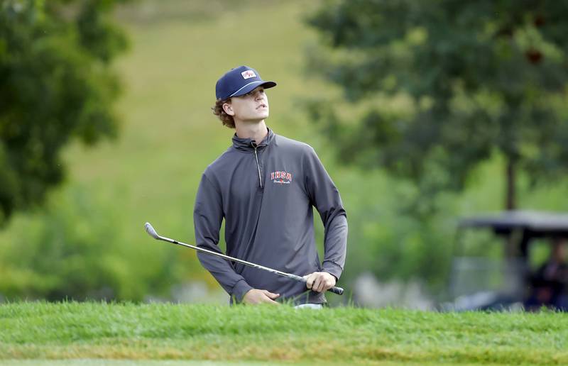 Logan Novay of Geneva checks his chip shot to the green during the DuKane Conference boys golf tournament at Bartlett Hills Tuesday, Sept. 23, 2025 in Bartlett.
