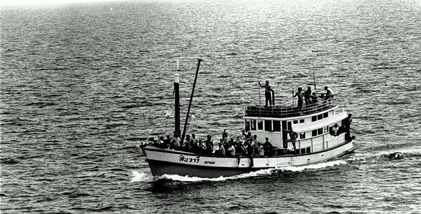 The Thai fishing boat with the released crew of the S.S. Mayaguez aboard as it was discovered by the U.S.S. Henry B. Wilson during the rescue mission for the captured U.S. merchant vessel and its crew off the coast of Cambodia in May 1975.