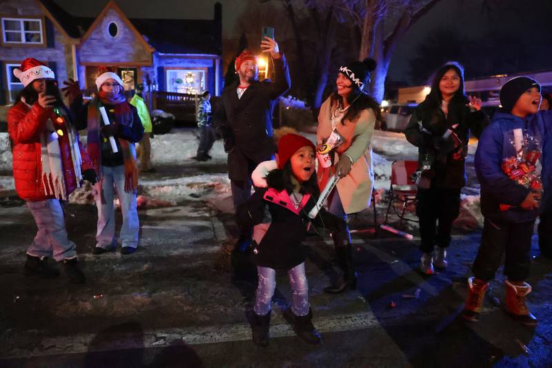 A young paradegoer excitedly reacts as Santa Claus passed by during the 40th annual Bradley Christmas Parade on Friday, Dec. 5, 2025.