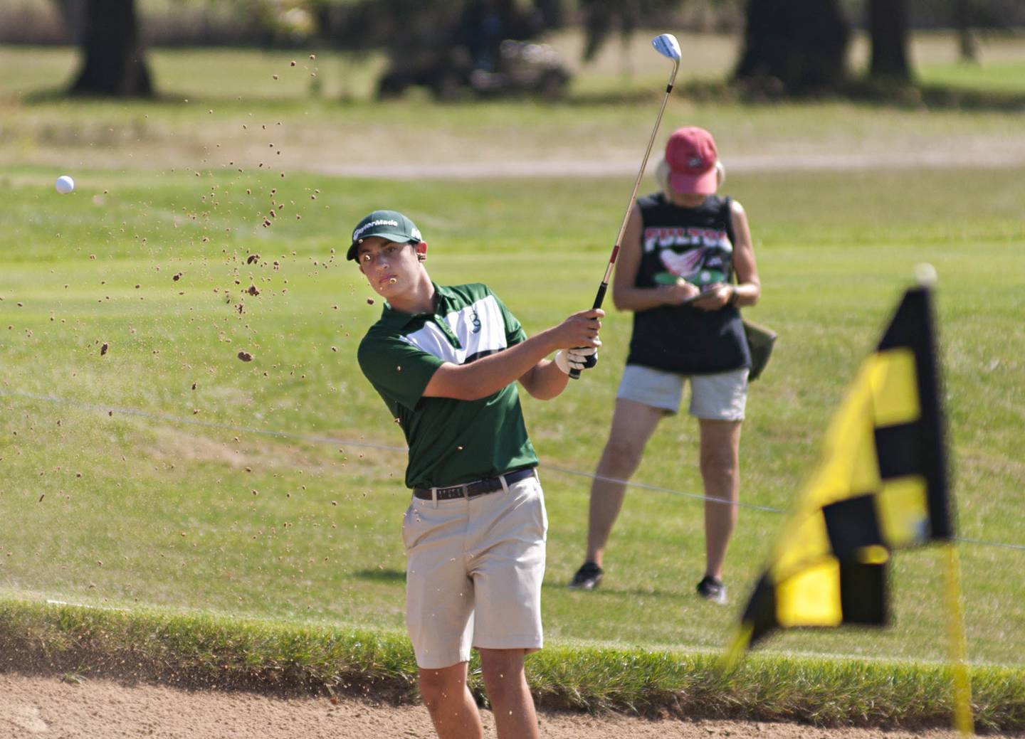 St. Bede's Jake Delaney blasts out of the sand during the class A boys golf regionals Wednesday, Sep. 29, 2021 at Byron Hills in Port Byron.