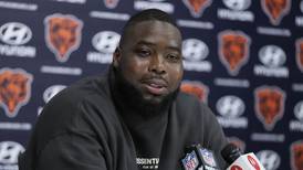Nate Davis showed up Sunday with a back injury. On Wednesday, the Chicago Bears cut him