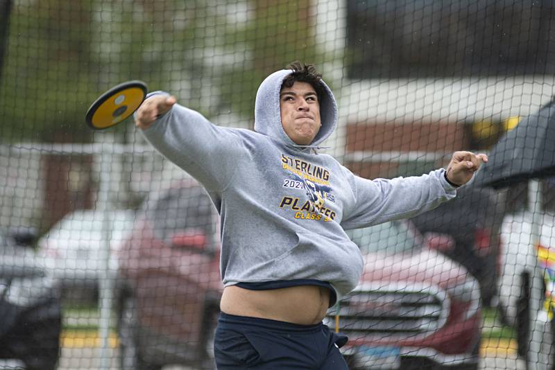 Sterling's Anthony Amezola throws the disk Friday, April 29, 2022 at the Sterling Night Relays.