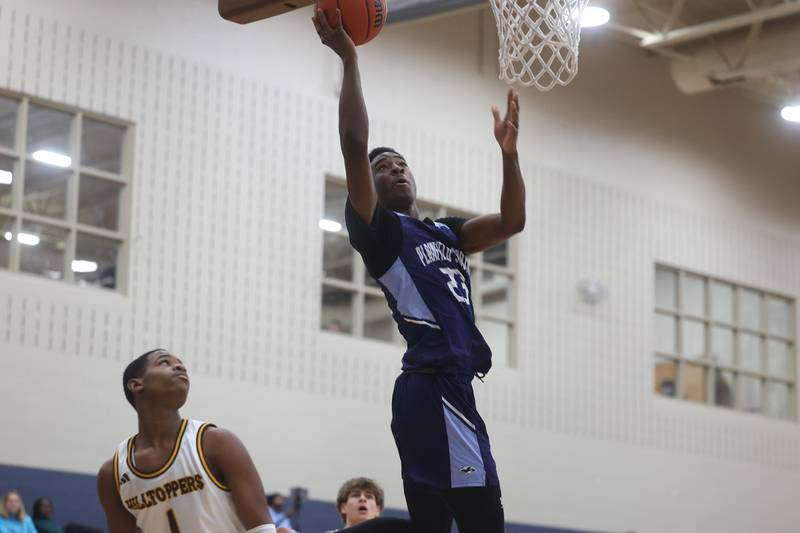 Plainfield South’s Jake Troyner puts up a shot against Joliet Catholic on Wednesday, Jan. 17th, 2024 in Joliet.