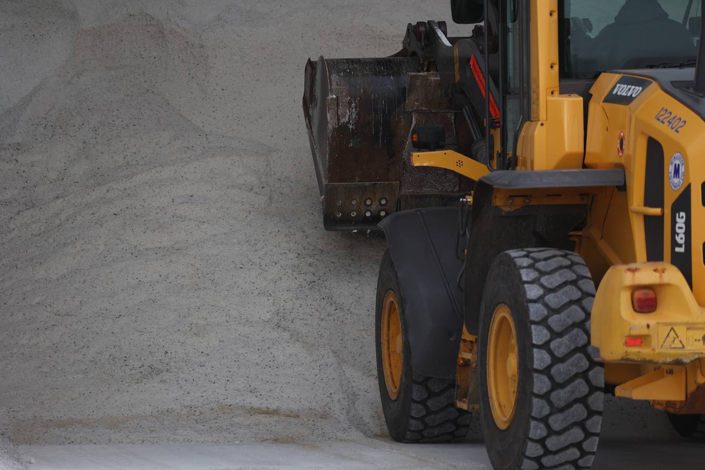 A front loader works a the salt pile at the IDOT facility in Lockport.