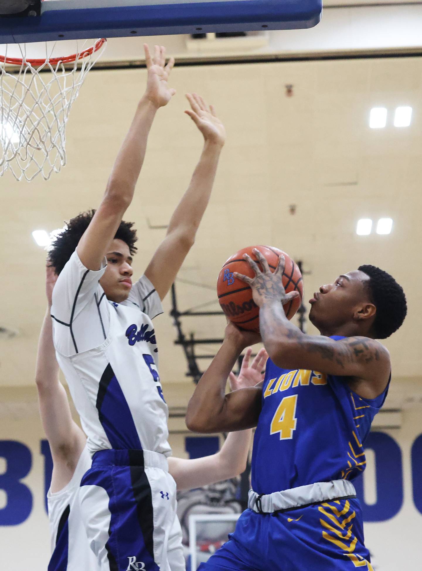 Lyons’ Caleb Greer (4) tries to get a shot past Riverside Brookfield’s Cameron Mercer (5) during a boys varsity basketball game on Friday, Jan. 26, 2024 in Riverside, IL.