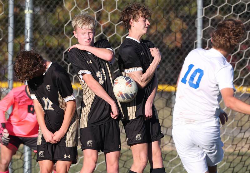 The Sycamore wall stops the free kick of Burlington Central’s Samuel Knych Wednesday, Oct. 23, 2024, during their Class 2A Sycamore Regional semifinal.