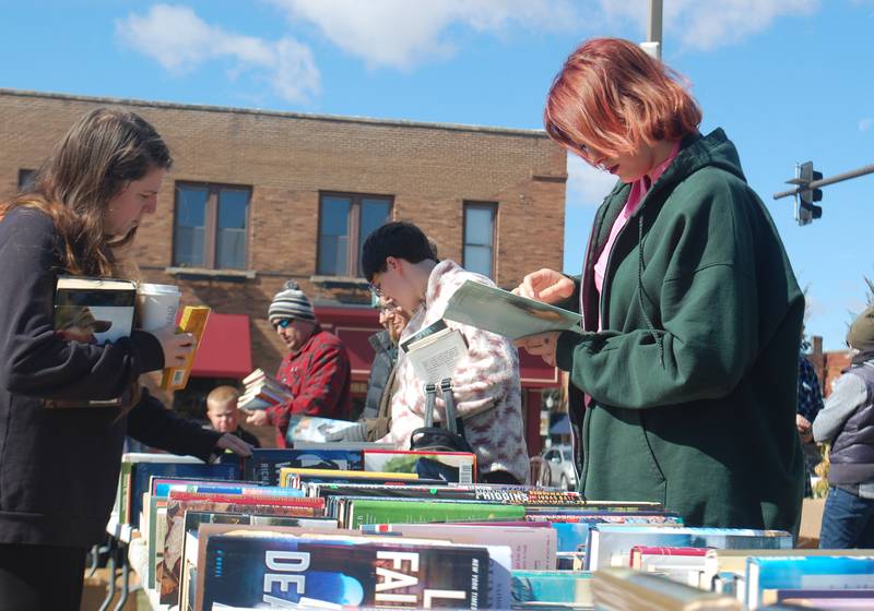 Shoppers browse the tables of used books for sale during the fourth annual Lit Fest Saturday, Oct. 15, 2022 at the Jordan block in downtown Ottawa.