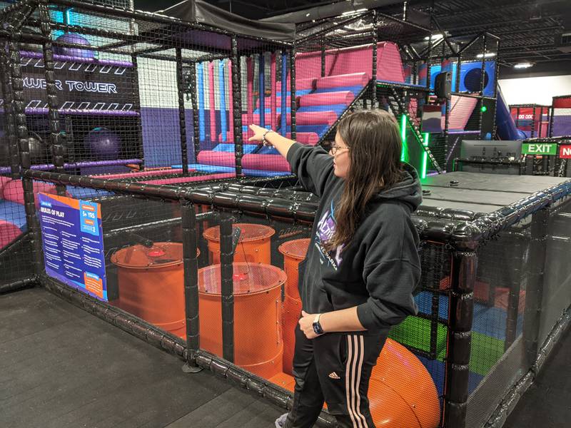 Altitude Trampoline Park general manager Hannah Nicolas shows off one of the new attractions at the park.