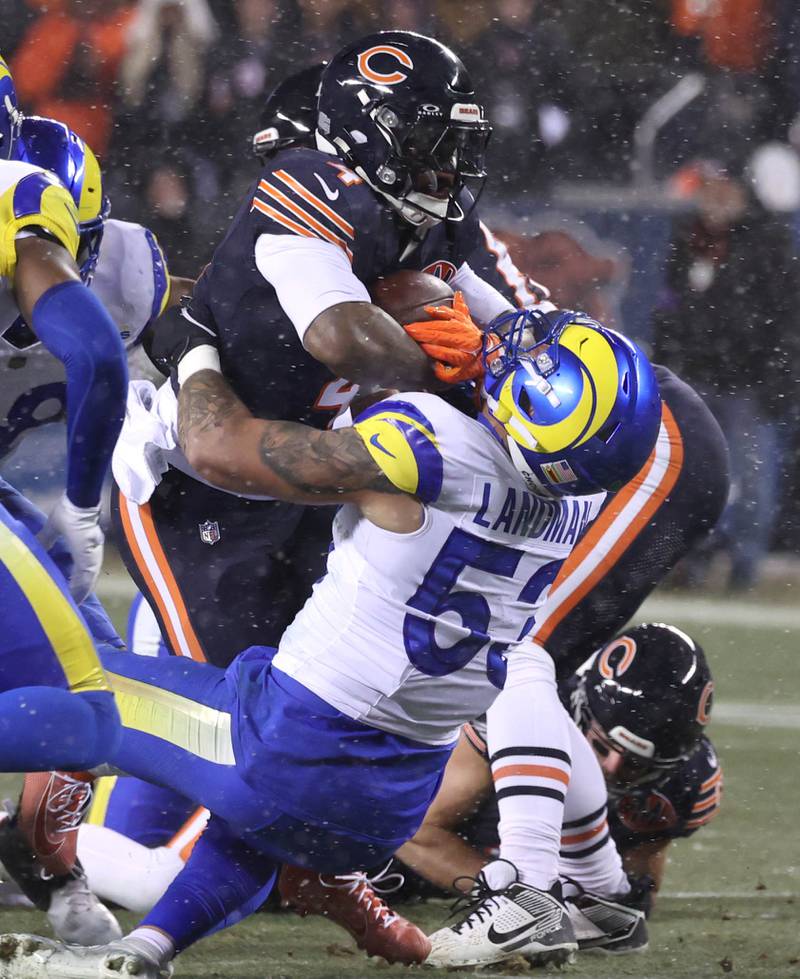 Chicago Bears running back D'Andre Swift runs into Los Angeles Rams linebacker Nate Landman Sunday, Jan. 18, 2026, during their NFC divisional playoff matchup at Soldier Field in Chicago.