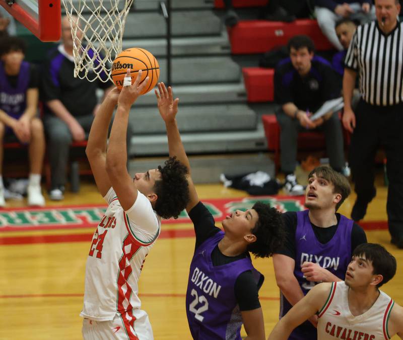 L-P's Marion Persich drives to the hoop over Dixon's Xavion Jones on Tuesday, Jan. 20, 2026 in Sellett Gymnasium at L-P High School.