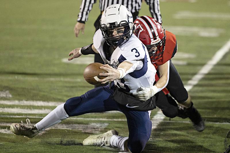 Ridgewood’s Ryle Catour reaches for a first down against Amboy during the I8FA championship Friday, Nov.17, 2023 at Monmouth College