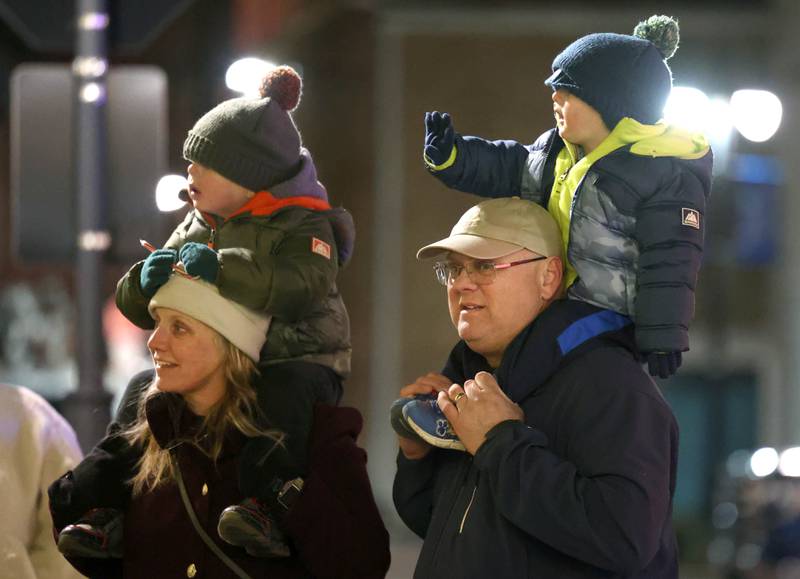 Kids and adults alike waved Thursday, Dec. 5, 2024, as Santa Claus arrived in front of the Egyptian Theatre during the DeKalb Chamber of Commerce’s Lights on Lincoln and Santa Comes to Town.