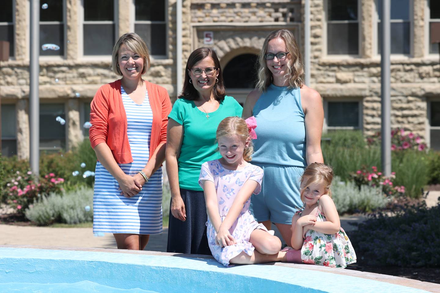 Allison Cann, left, Tina Davidson and Ashley York and her daughters Emily, 8, and Adeline, 3, stand outside Lockport City Hall on Thursday, July 27.