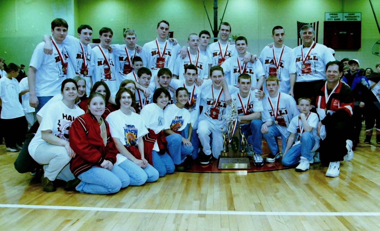 The Hall Red Devils celebrate their 1996-97 state runner-up finish during the community reception at Red Devils Gymnasium.