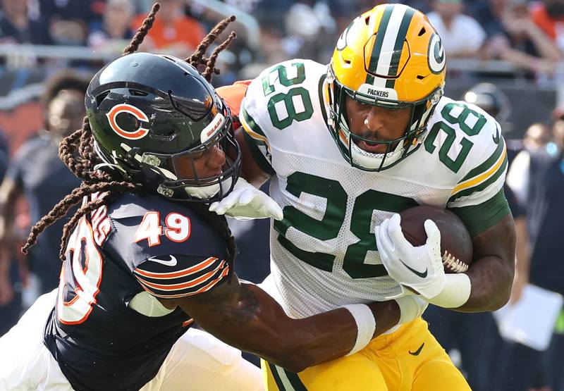 Chicago Bears linebacker Tremaine Edmunds tackles Green Bay Packers running back AJ Dillon for a loss during their game Sunday, Sept. 10, 2023, at Soldier Field in Chicago.