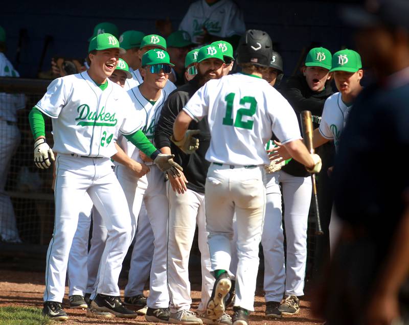 York players celebrate a run by Josh Fleming in extra innings during a Class 4A St. Charles North Sectional semifinal game against Lake Park on Wednesday, May 29, 2024.