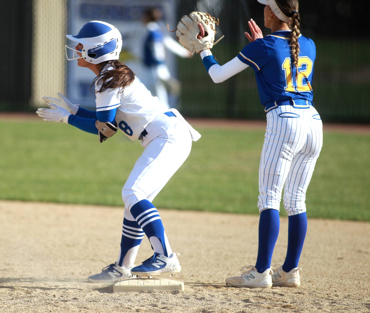 St. Charles North's Ginger Ritter lands on second base after hitting a double during a game against Wheaton North on Tuesday, April 15, 2025 in St. Charles.