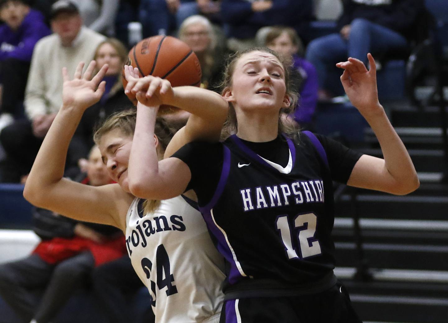 Cary-Grove's Annika Nordin battles with Hampshire's Kaitlyn Milison for a rebound during a Fox Valley Conference girls basketball game Friday, Dec.2, 2022, between Cary-Grove and Hampshire at Cary-Grove High School in Cary.