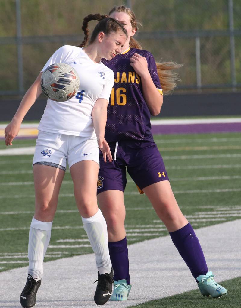 Princeton's Audry Thompson knocks the ball down in front of Mendota's Elaina Reddin during the Class 1A Regional semifinal game on Tuesday, May 9, 2023 at Mendota High School.