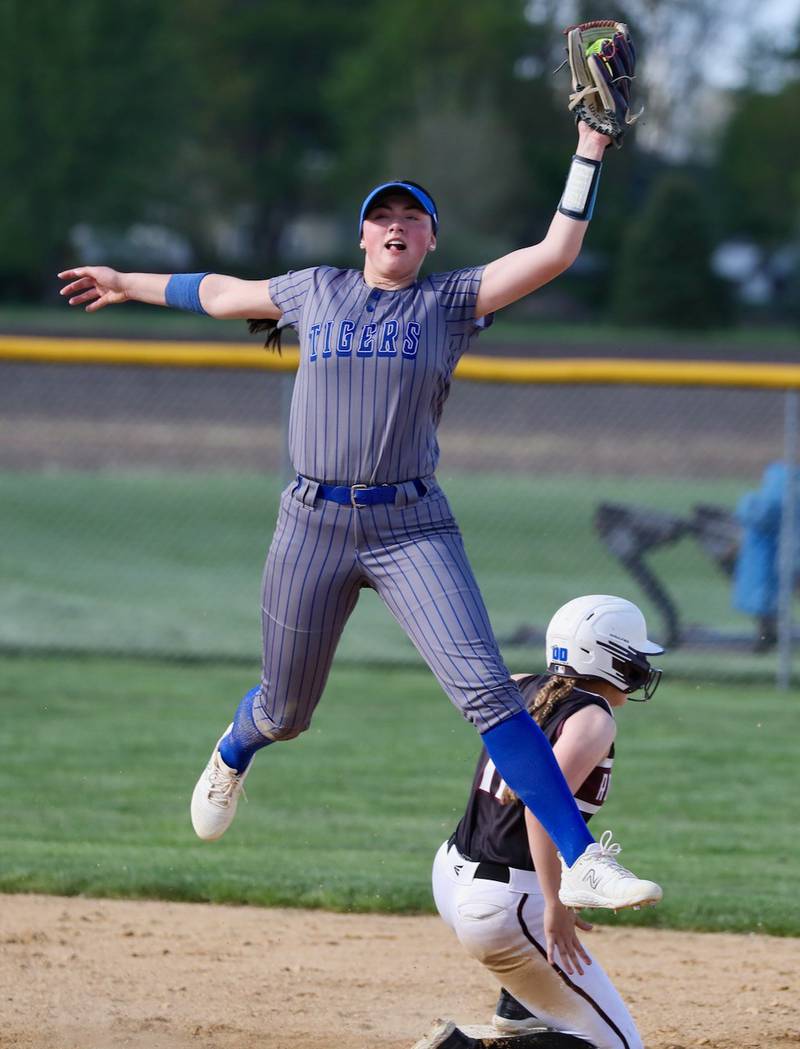 Princeton short stop Keely Lawson leaps to snag a throw to second base Tuesday against Rockridge.