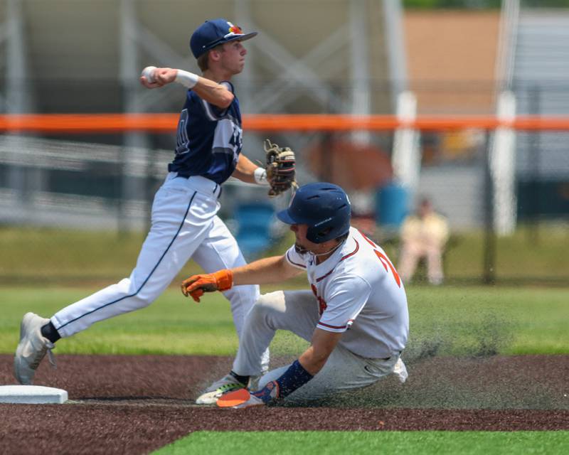 Oswego's Cade Duffin (23) slides into second during Class 4A Romeoville Sectional final game between Oswego East at Oswego.  June 3, 2023.