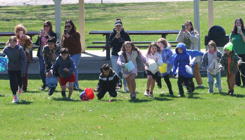 Kids race to find eggs during the Easter Egg Hunt on Saturday, March 28, 2026 at Centennial Park in Peru.