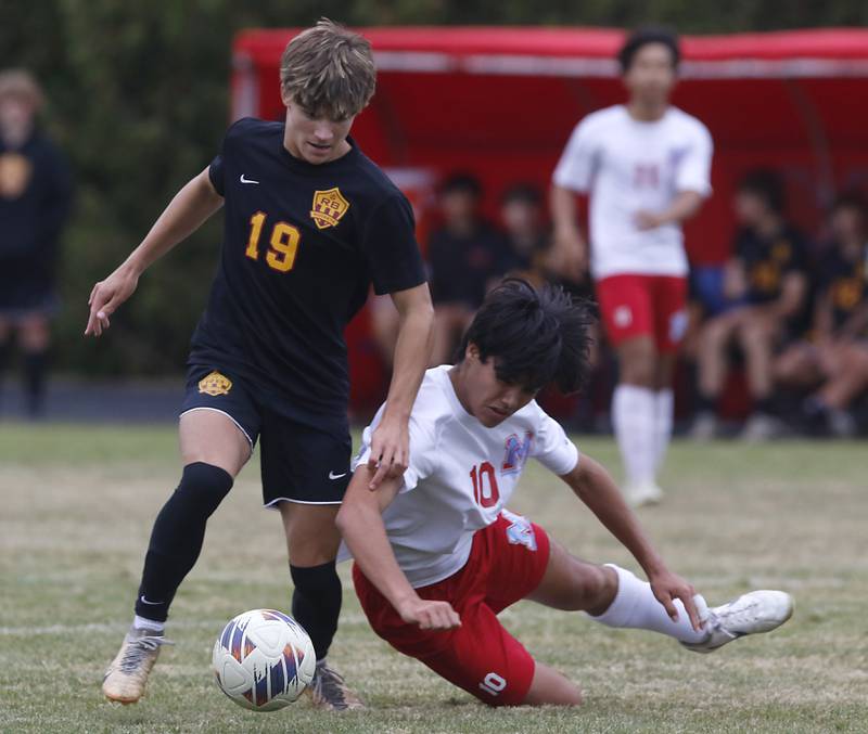 Richmond-Burton's Nicholas Kyes controls the ball in front of Marian Central's Henry Bonnet during the IHSA Class 1A Marian Central Regional Boys Soccer Final match on Tuesday, Oct. 22, 2024, at Marian Central High School in Woodstock.