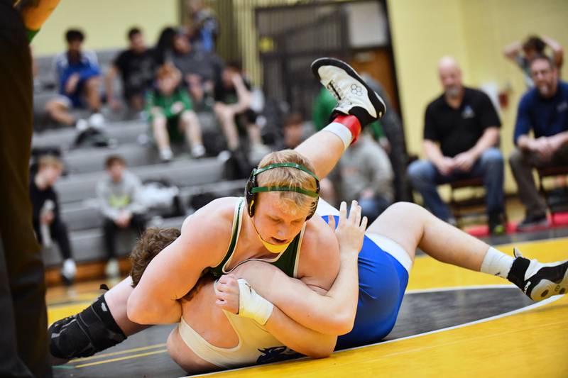 Coal City's Cade Poyner moves to pin Peotone's Evan Pane during Poyner's 190-pound match vicitory on Saturday, Feb. 8, 2025, in the IHSA Class 1A Herscher regional.