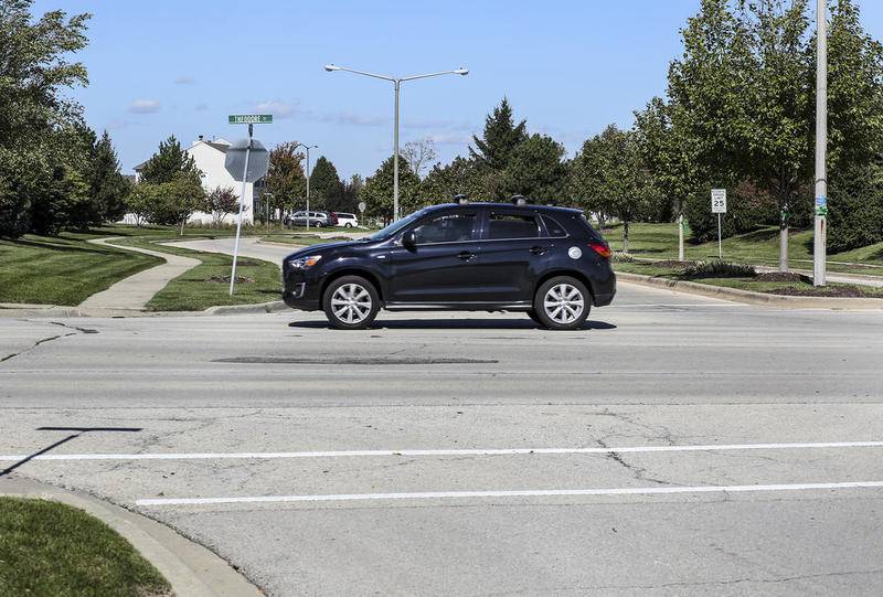 A car passed the intersection of Theodore Street and Roth Drive on Monday, Oct. 16, 2017, in Joliet, Ill.